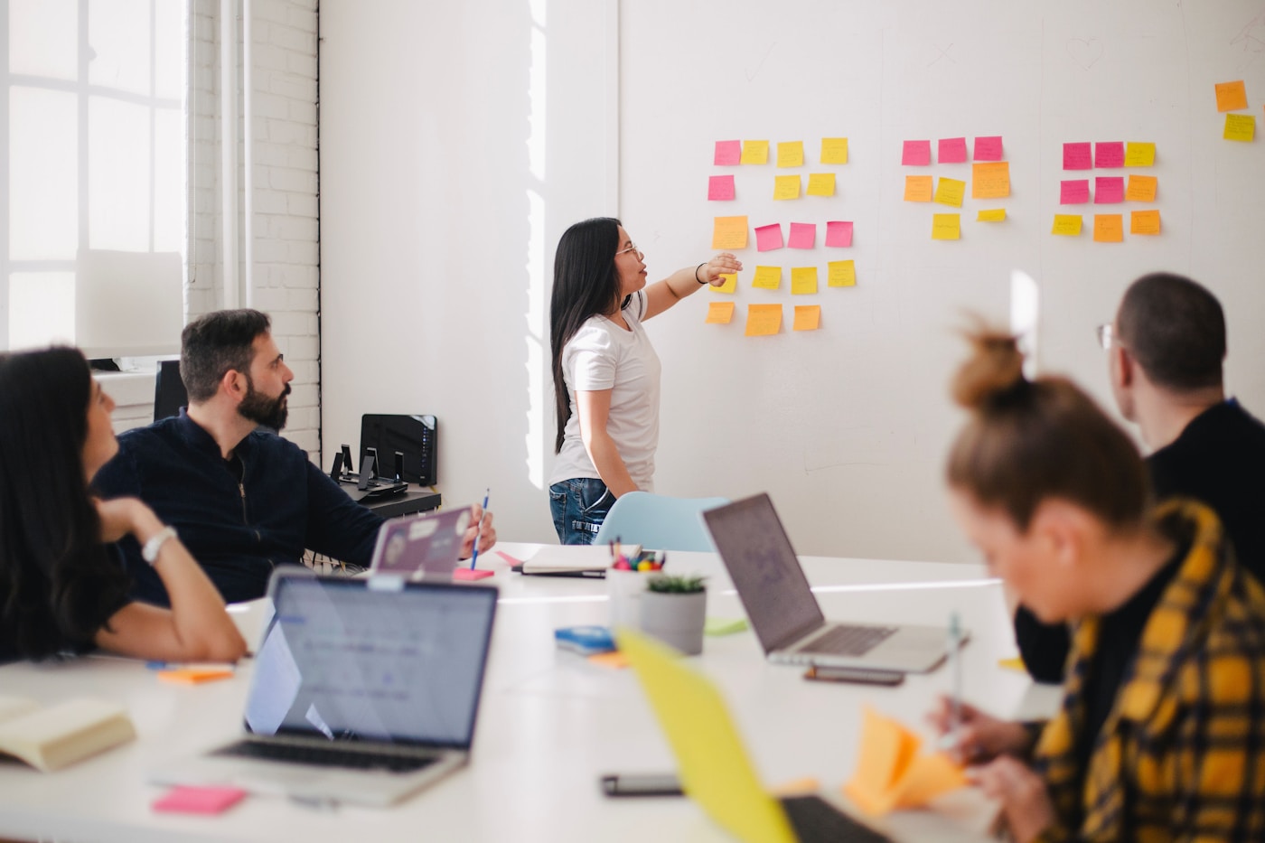 Marketing team planning a campaign with sticky notes
